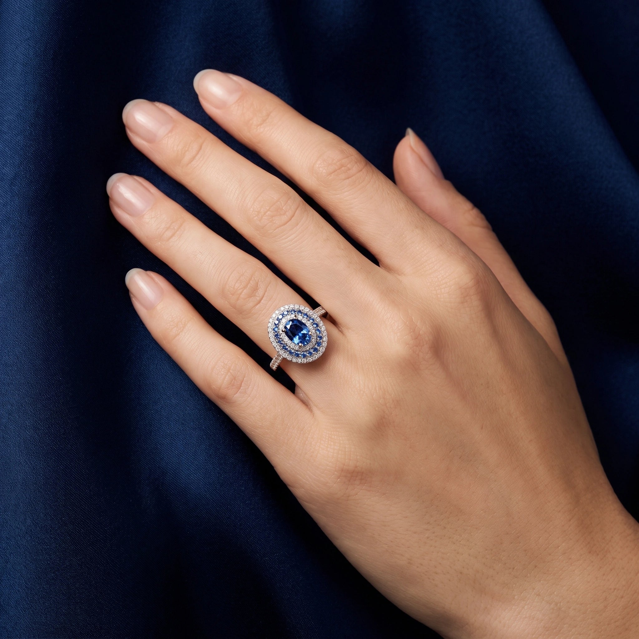 Close-up of oval blue moissanite double halo ring