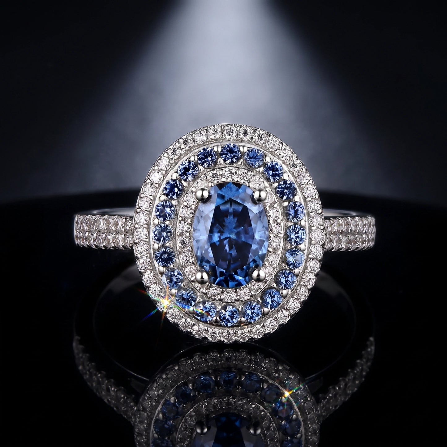 Oval blue moissanite double halo ring, cinematic product shot