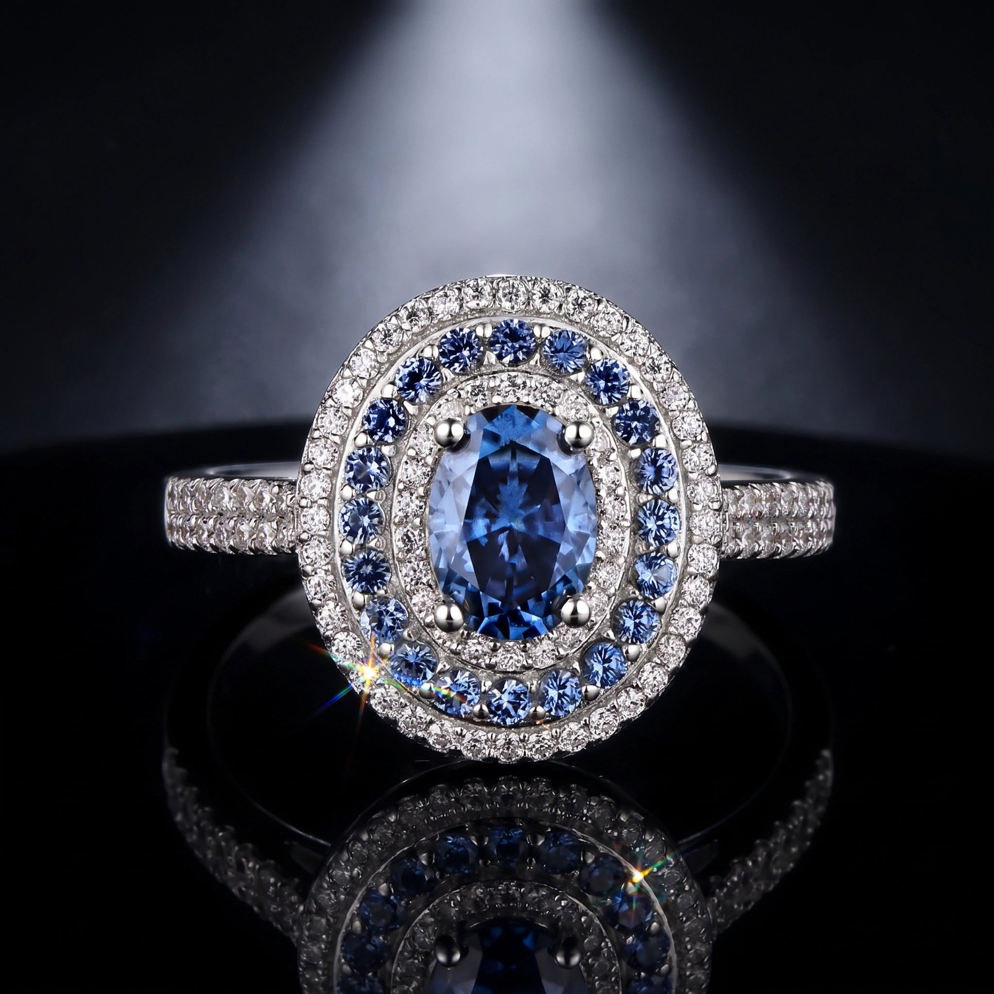 Oval blue moissanite double halo ring, cinematic product shot
