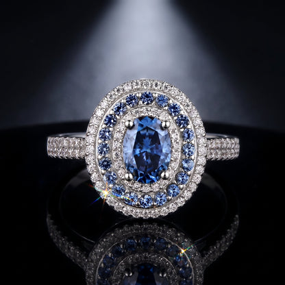 Oval blue moissanite double halo ring, cinematic product shot