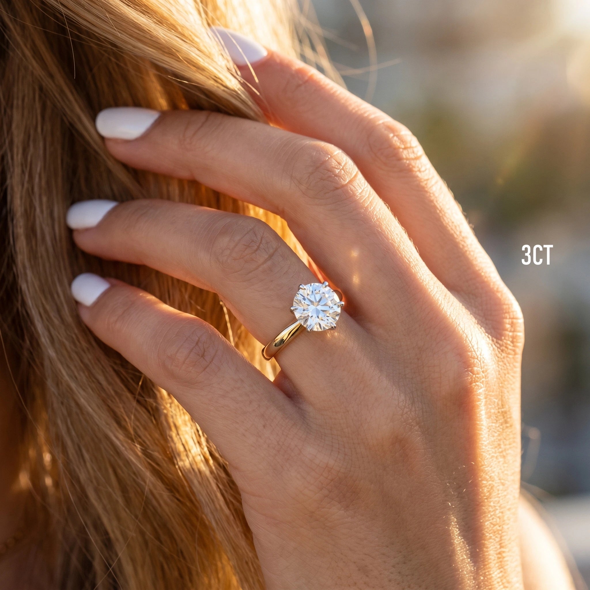 Hand touching hair, wearing the Shenae tulip setting diamond ring