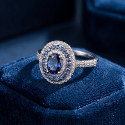 Blue moissanite halo ring, luxury lifestyle shot