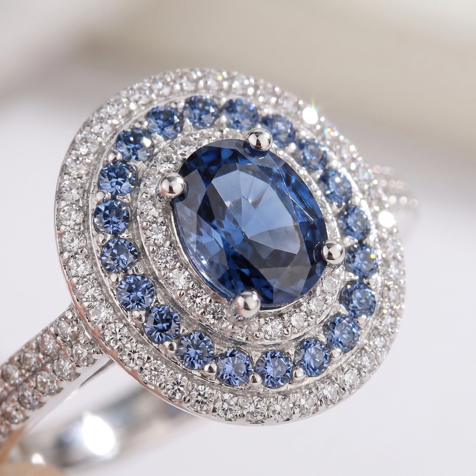 Macro close-up of blue moissanite double halo and pave band