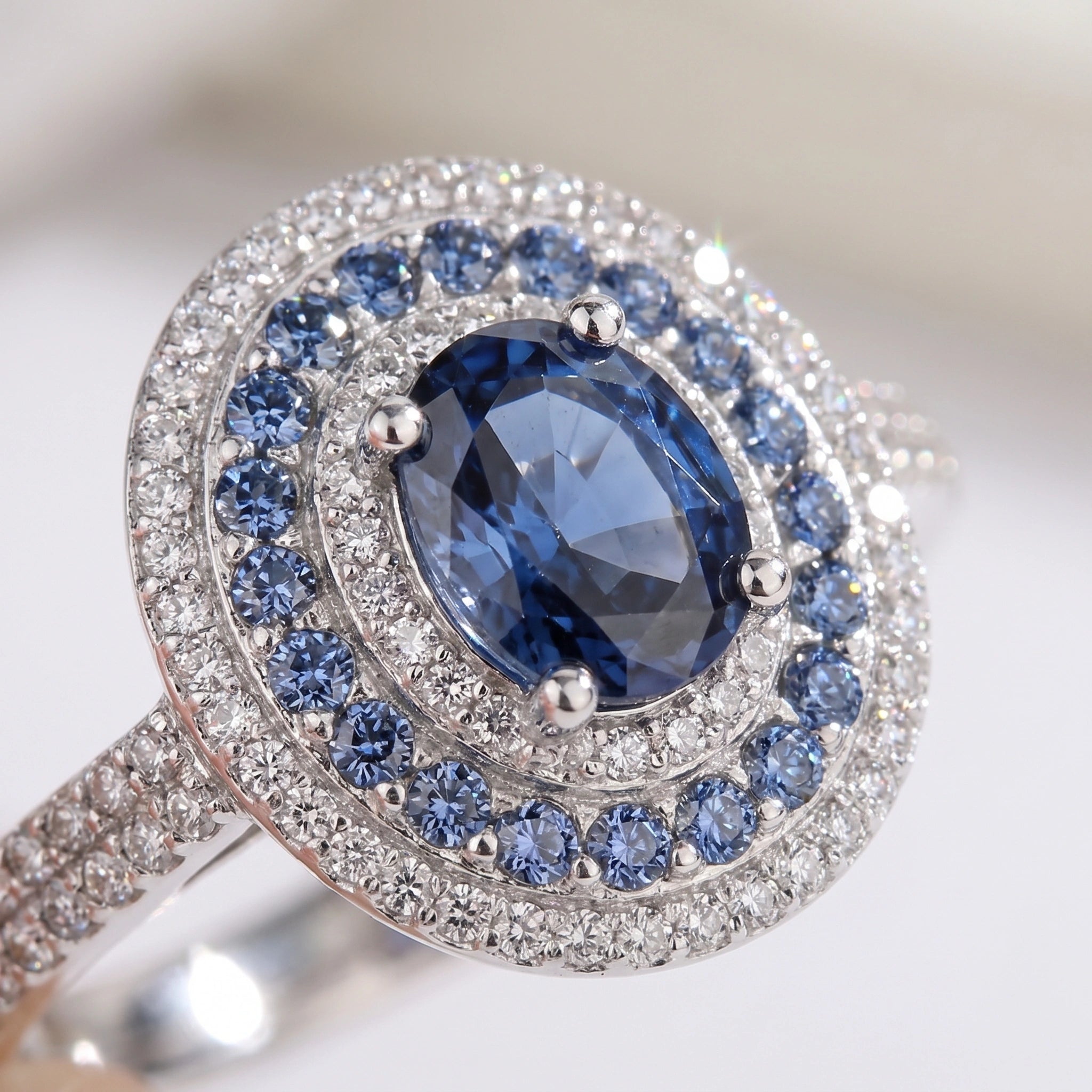 Macro close-up of blue moissanite double halo and pave band