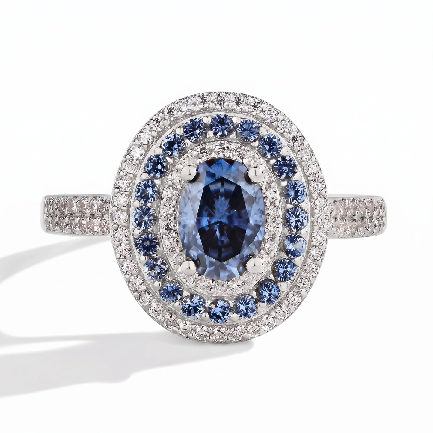 Blue moissanite halo ring, studio product photography