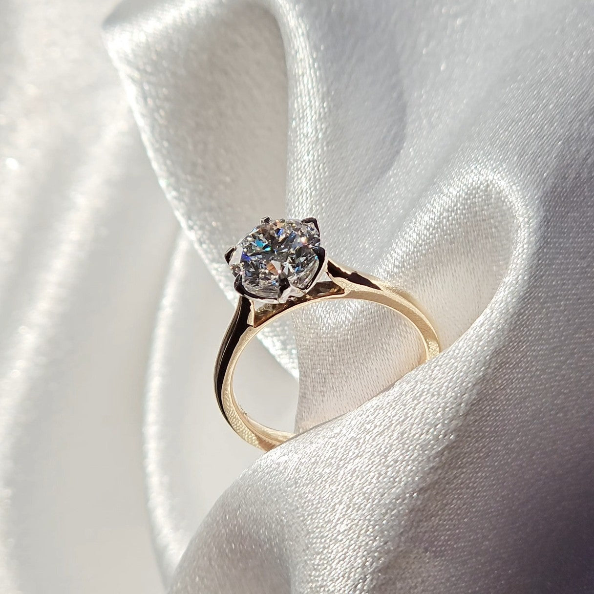 Tulip round solitaire diamond ring worn on the hand