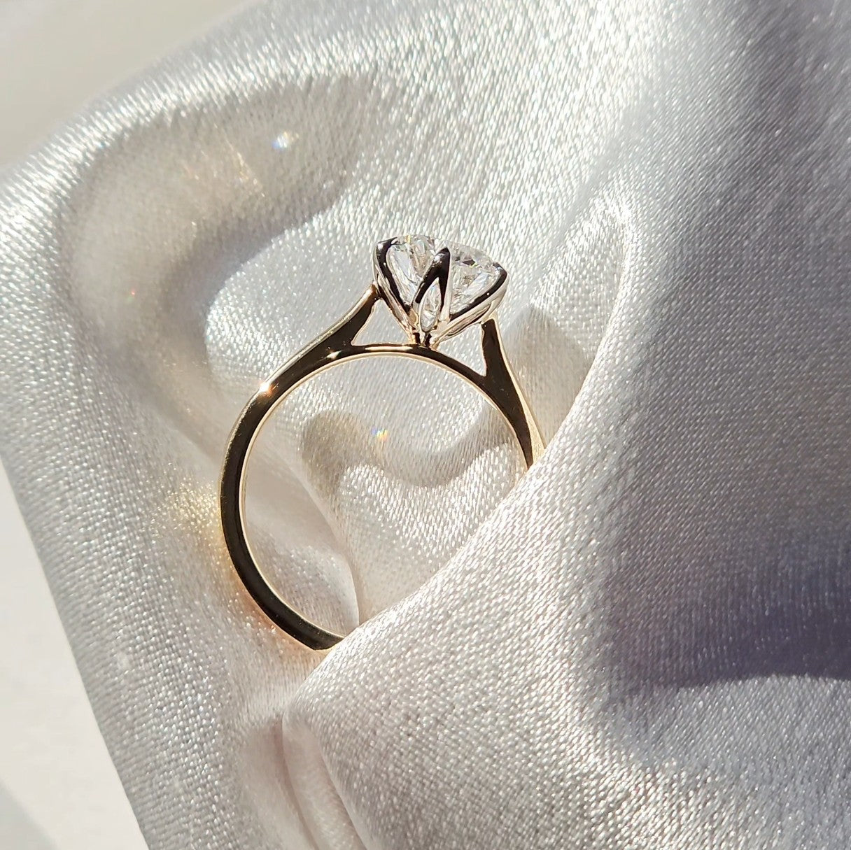 Tulip round solitaire diamond ring, close-up of the petal basket setting